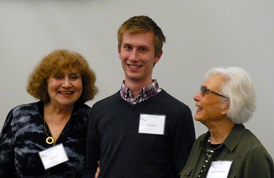 Ms. Inge Marra and Ms. Anne Schumacher with a male UIC student